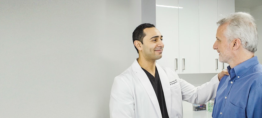 Dr. Hanna greeting a patient Dr. Hanna greeting a patient